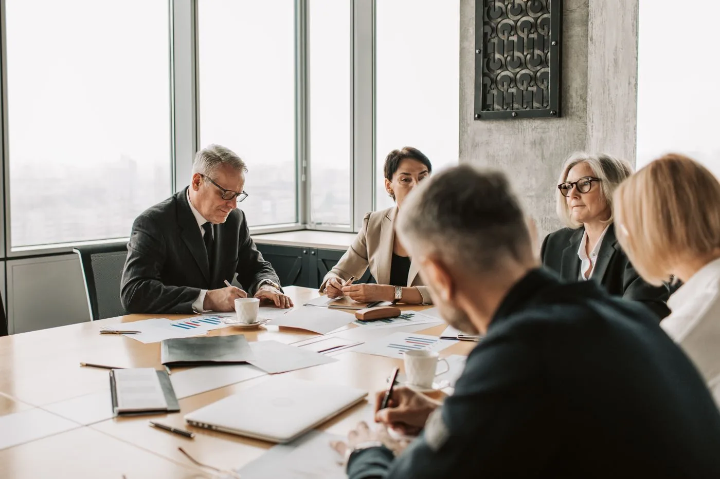 Consultants in a collaborative strategy session around a conference table