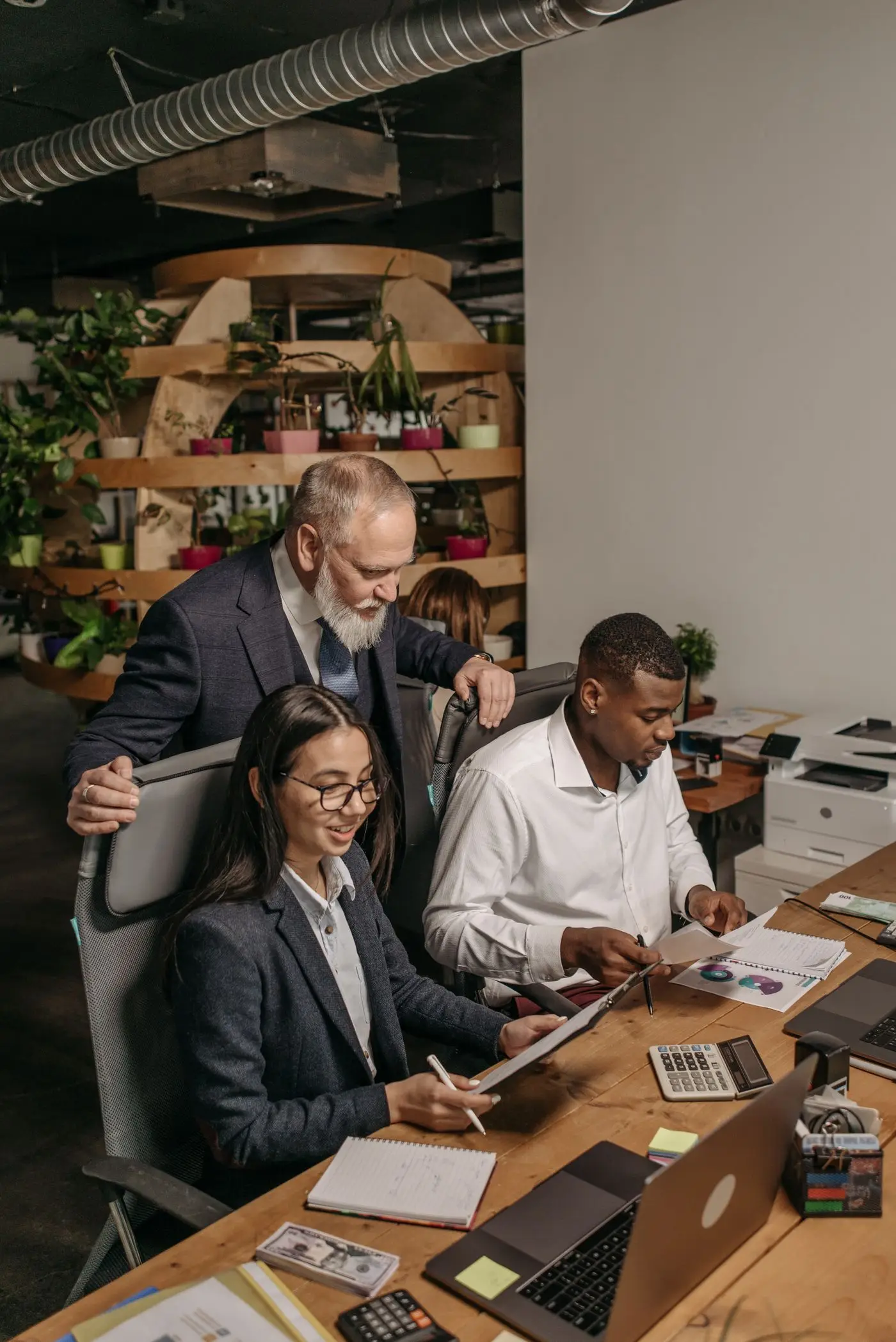 Business consulting team collaborating around a conference table